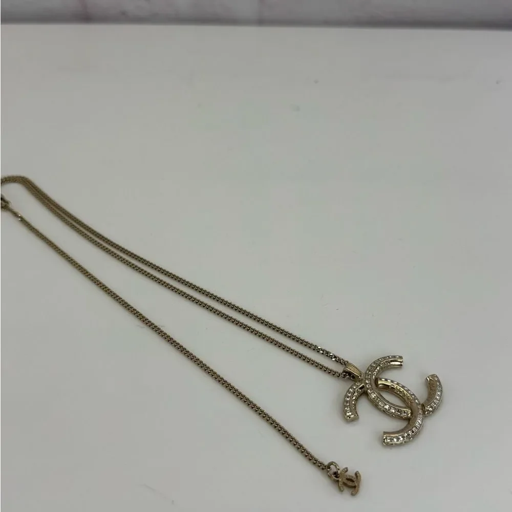 CHANEL Multi Logo Engraved Gold Crystal CC Pendant Necklace